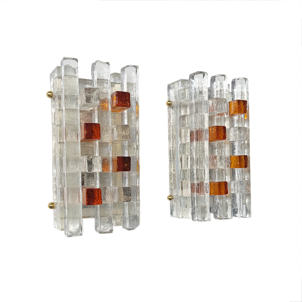Close-up of layered clear and amber glass bars in geometric grid on 1970s Poliarte wall light
