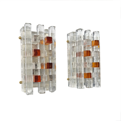 Close-up of layered clear and amber glass bars in geometric grid on 1970s Poliarte wall light