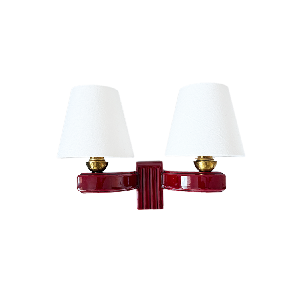 Twin-arm form and burgundy patina on 1930s French ceramic wall light