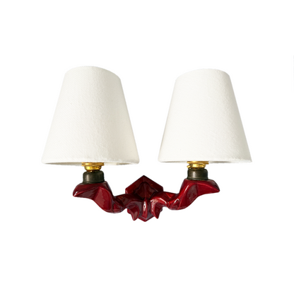 1950s French twin-arm wall light with burgundy glazed hexagonal ceramic base, curved brass arms and white linen shades