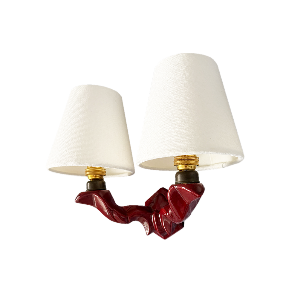Curved brass arms with natural patina on 1950s French ceramic twin-arm wall light, shown without shades
