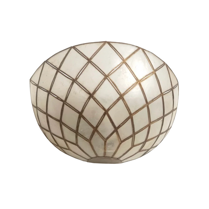 A round, dome-shaped decorative bowl or planter made of white mother-of-pearl tiles with a gold grid pattern, shown against a plain white background.