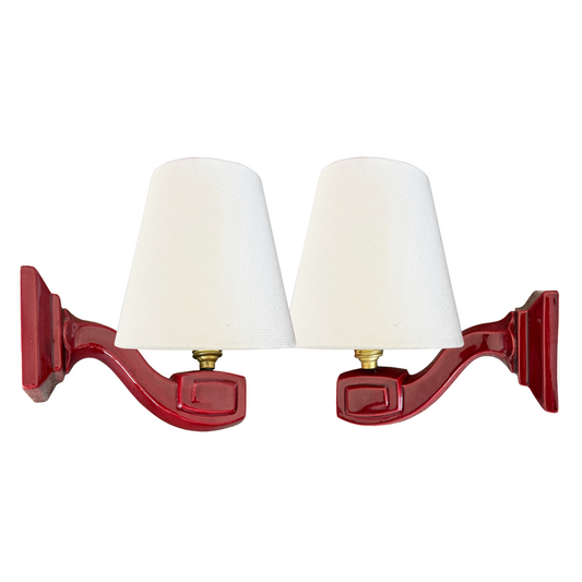 air of French Art Deco burgundy glazed ceramic wall sconces with white linen shades, 1930s