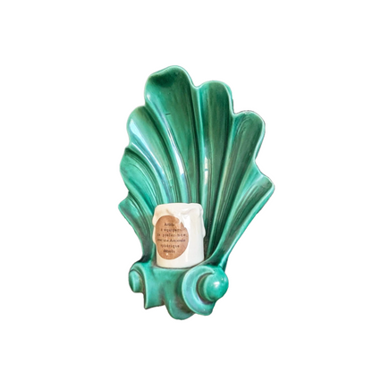 Side profile of emerald green glazed ceramic shell sconce showing depth and wall mount, 1950s France