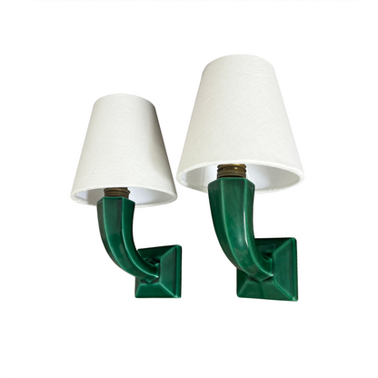 Close-up of emerald green glaze and geometric architectural detailing on 1940s French ceramic sconce