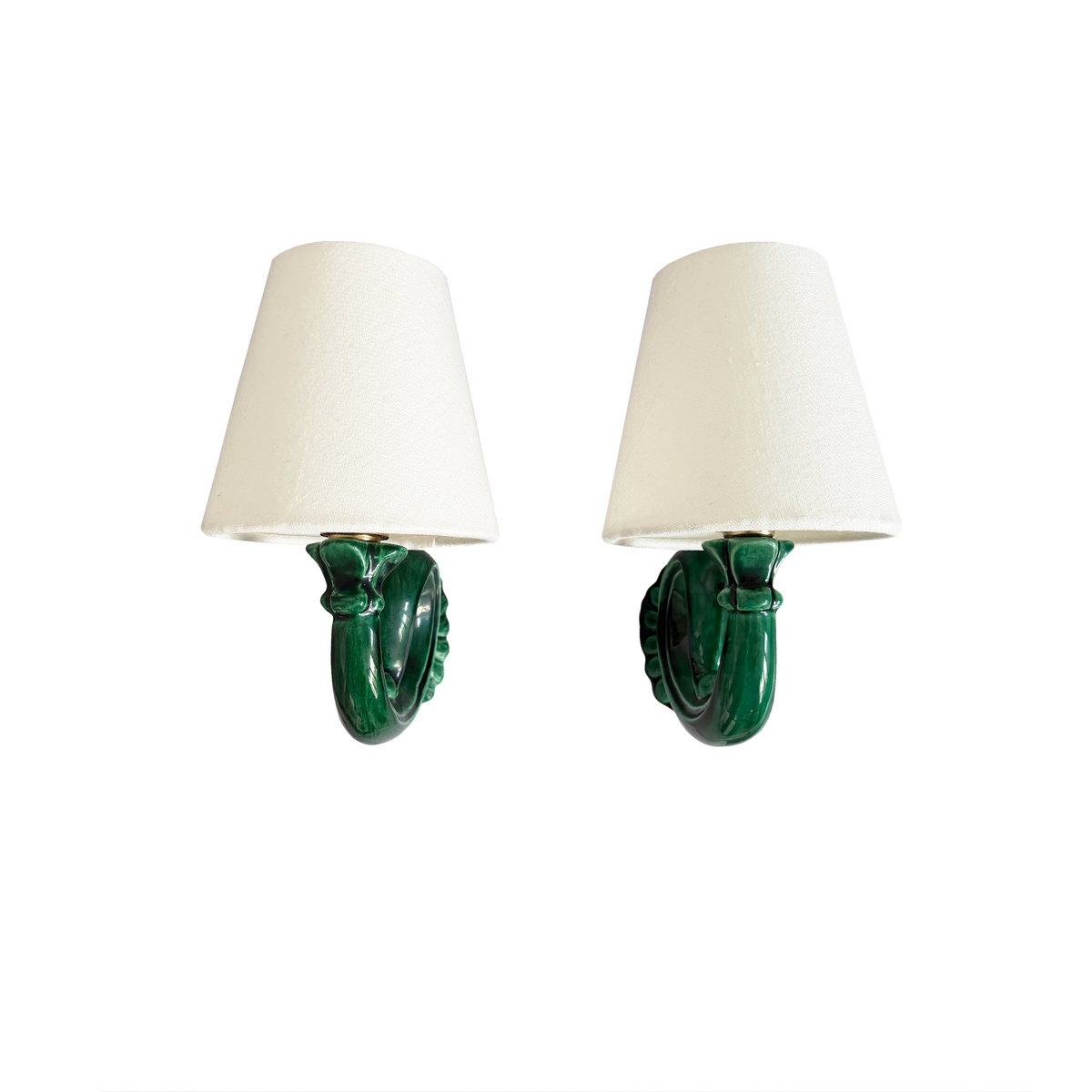 Close-up of rich green glaze and hand-finished ceramic detailing on French Art Deco sconce