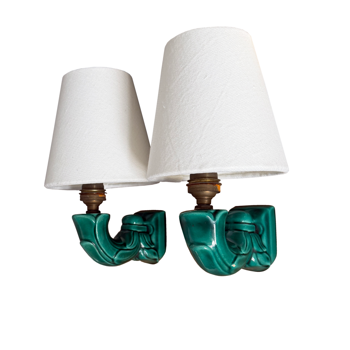 Pair of French emerald green filigree ceramic wall sconces with white linen shades, 1940s