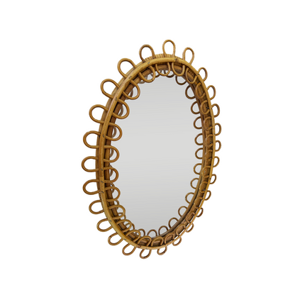 Honey-toned aged rattan patina and oval frame on 1960s Franco Albini style mirror