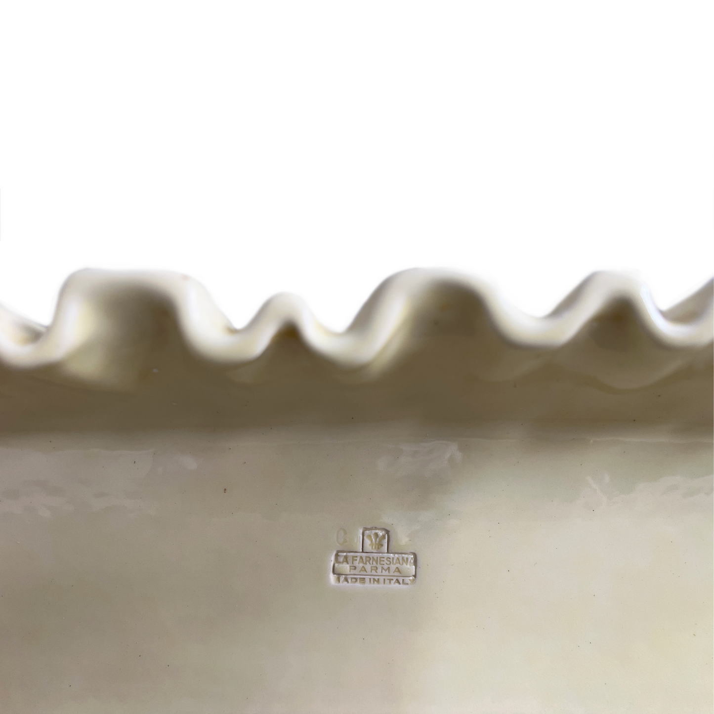 Close-up of soft pleated glaze detail on La Farnesiana butter yellow ceramic shelf