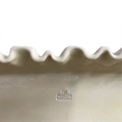 Close-up of soft pleated glaze detail on La Farnesiana butter yellow ceramic shelf