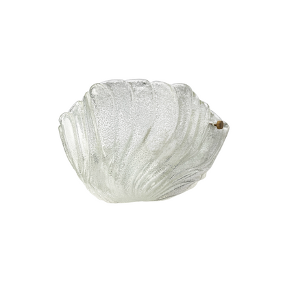 Close-up of hand-blown Murano glass with fluid undulating surface on crescent sconce