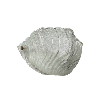Close-up of hand-blown Murano glass with fluid undulating surface on crescent sconce